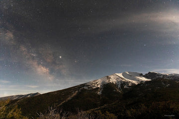 Mather Overlook picture of night sky, stars and a snow-capped mountain in Great Basin National Park